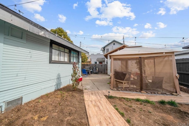 view of side of home featuring a patio area