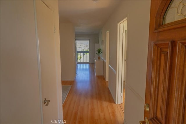 hall with light hardwood / wood-style flooring