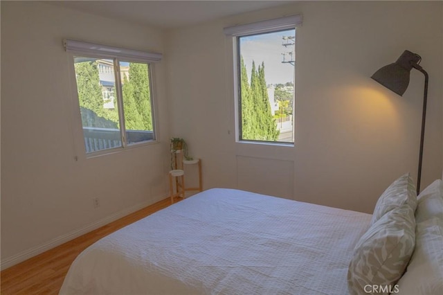 bedroom with hardwood / wood-style flooring