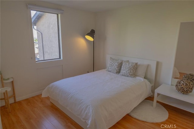 bedroom featuring hardwood / wood-style floors