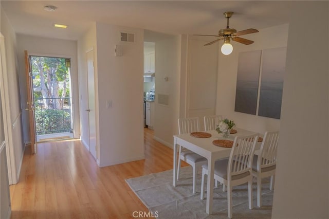 dining room featuring ceiling fan and light hardwood / wood-style flooring