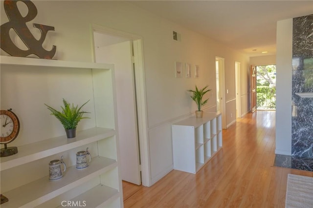 corridor featuring light hardwood / wood-style flooring