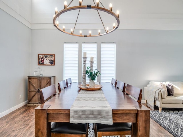 dining area featuring a chandelier and hardwood / wood-style flooring