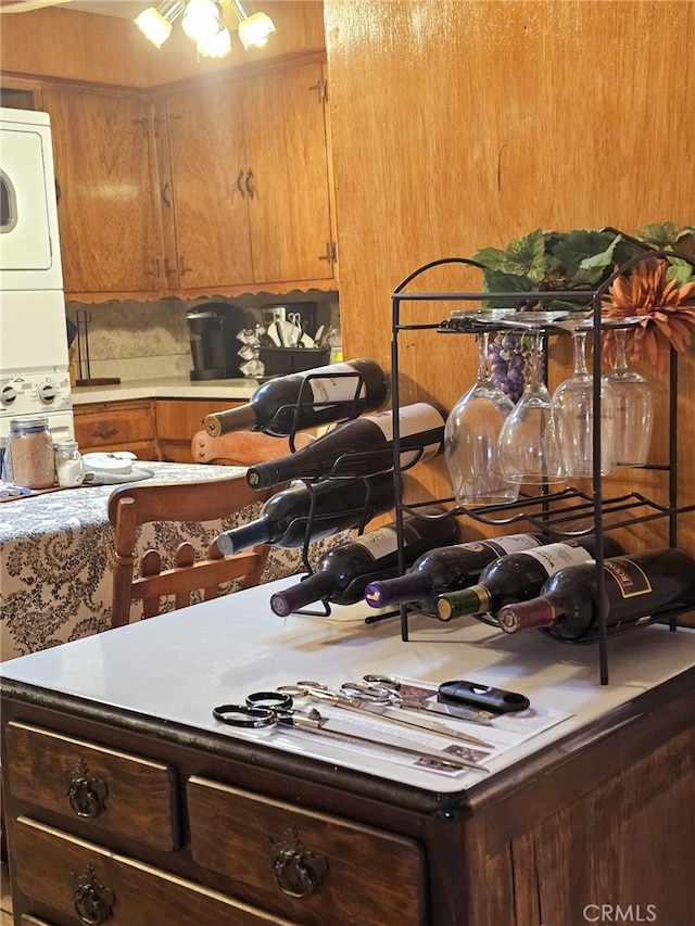 kitchen with stacked washer / drying machine