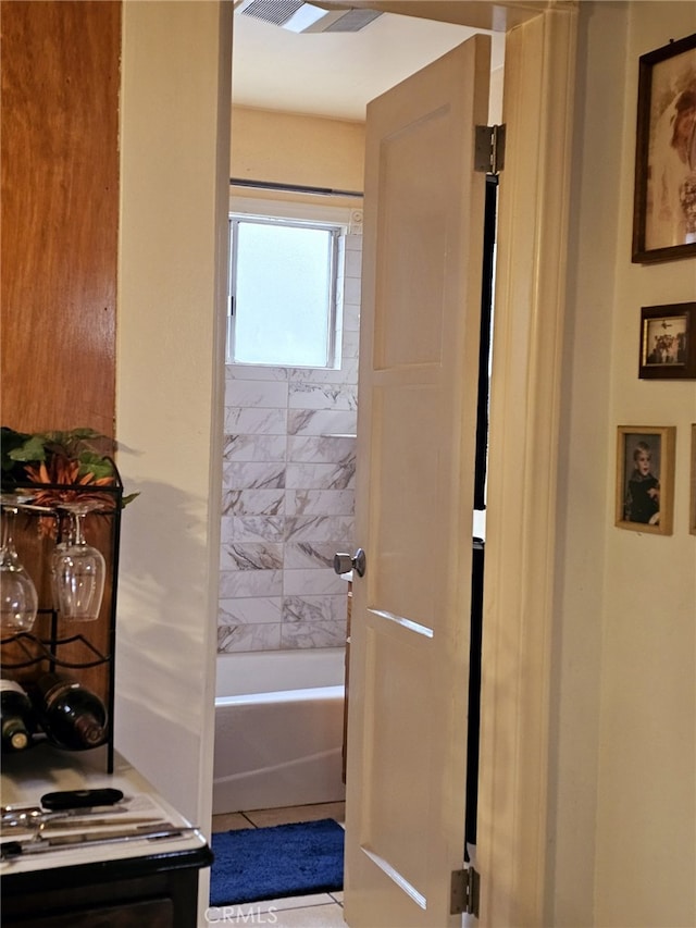 bathroom featuring a bathing tub and tile patterned floors