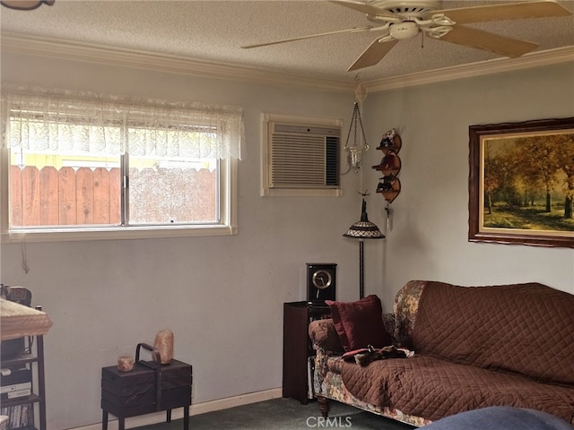 living room with ceiling fan, a textured ceiling, crown molding, and carpet