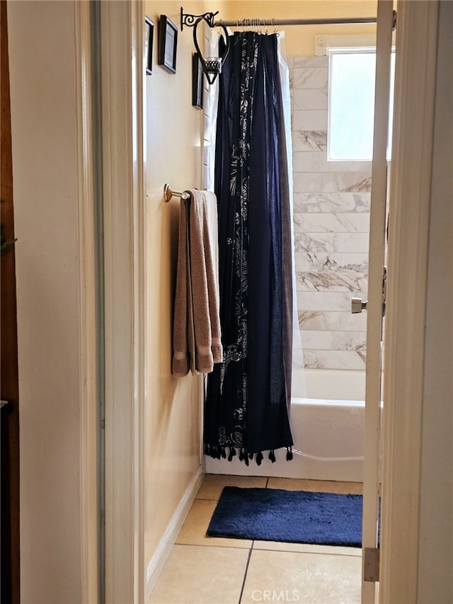 bathroom featuring shower / tub combo and tile patterned flooring