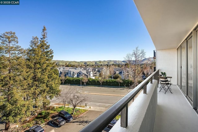 balcony featuring a mountain view