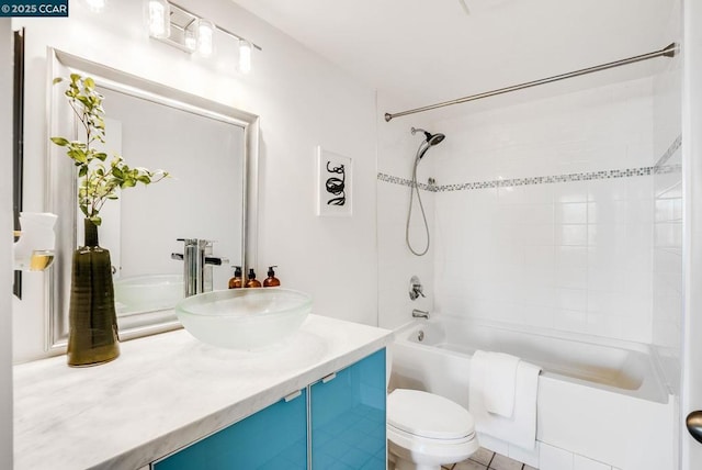 full bathroom featuring washtub / shower combination, vanity, and toilet