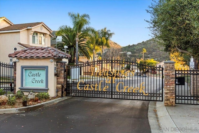 view of gate with a mountain view