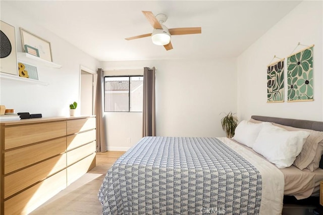 bedroom featuring ceiling fan and light hardwood / wood-style floors