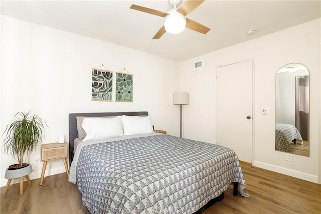 bedroom featuring ceiling fan and hardwood / wood-style floors