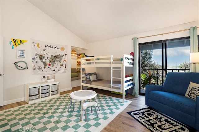 bedroom featuring wood-type flooring and lofted ceiling