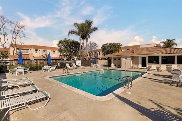 view of swimming pool featuring a patio