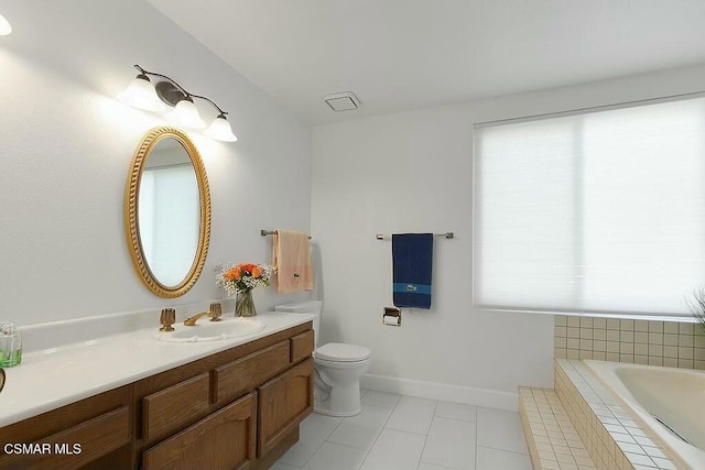 bathroom featuring toilet, vanity, plenty of natural light, and tile patterned floors