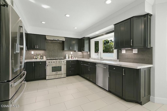 kitchen with tasteful backsplash, light tile patterned floors, stainless steel appliances, and range hood