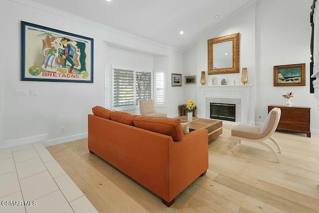 living room with light hardwood / wood-style floors, ornamental molding, and lofted ceiling