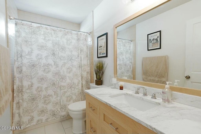 bathroom featuring toilet, tile patterned flooring, and vanity