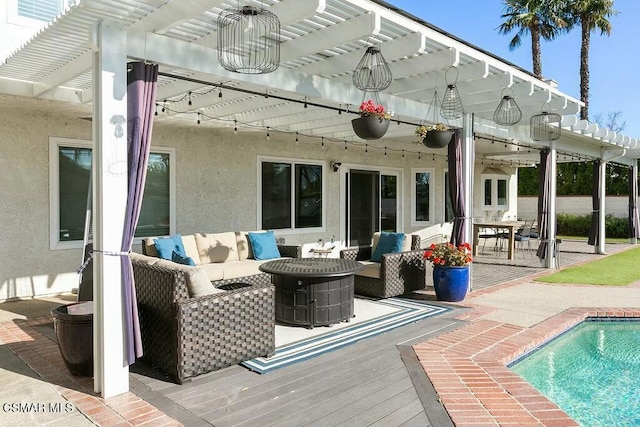 rear view of property with an outdoor hangout area, a pergola, a pool side deck, and ceiling fan