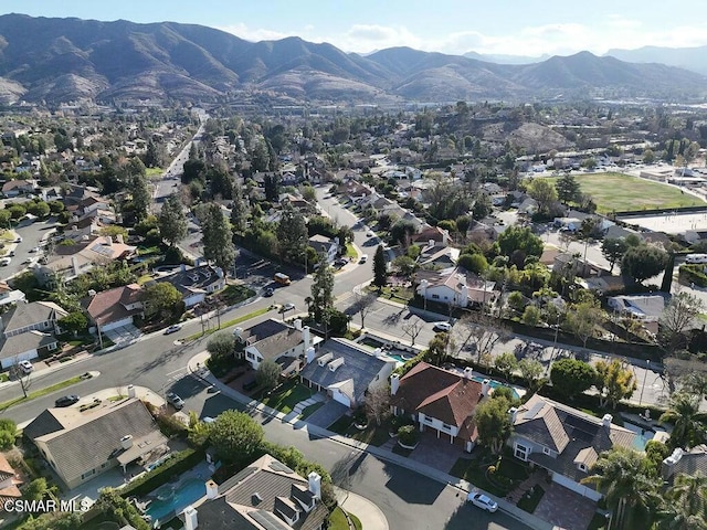 birds eye view of property featuring a mountain view