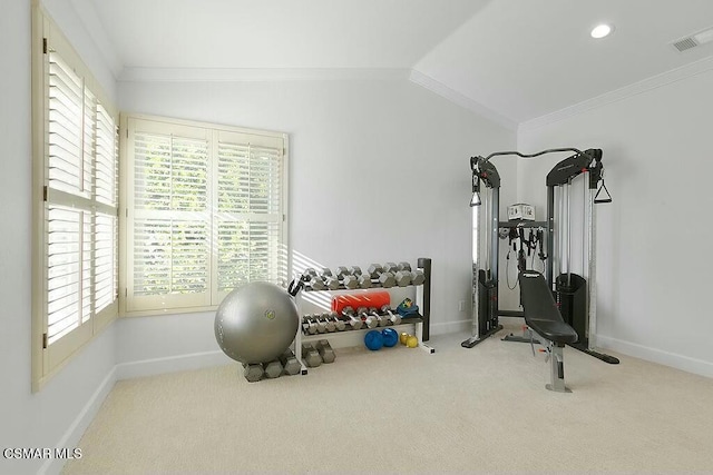 exercise room featuring carpet floors, ornamental molding, and vaulted ceiling