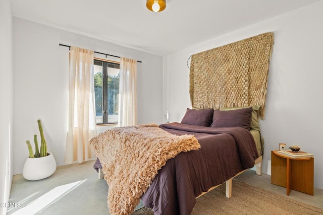 bedroom featuring light carpet