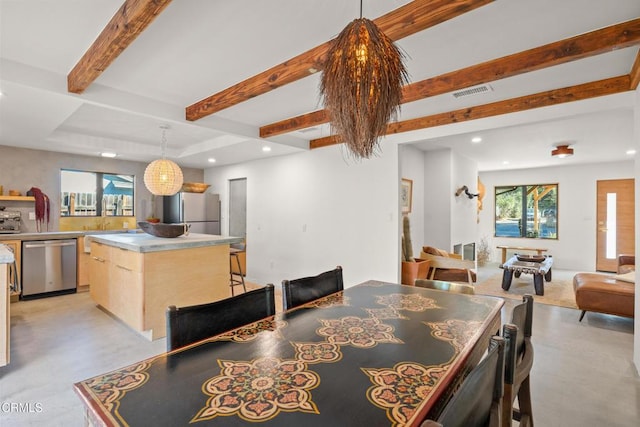 dining space with a healthy amount of sunlight, visible vents, beam ceiling, and recessed lighting