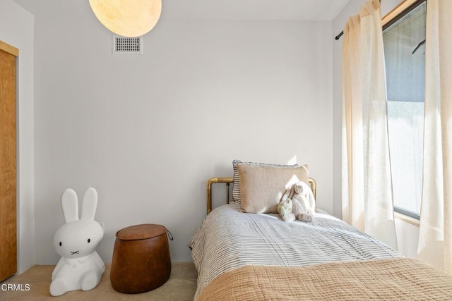 bedroom featuring visible vents