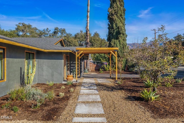 view of yard featuring driveway and fence