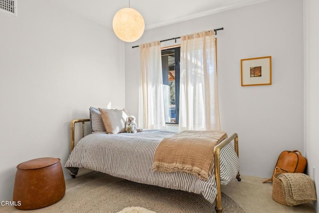 bedroom with visible vents and carpet floors