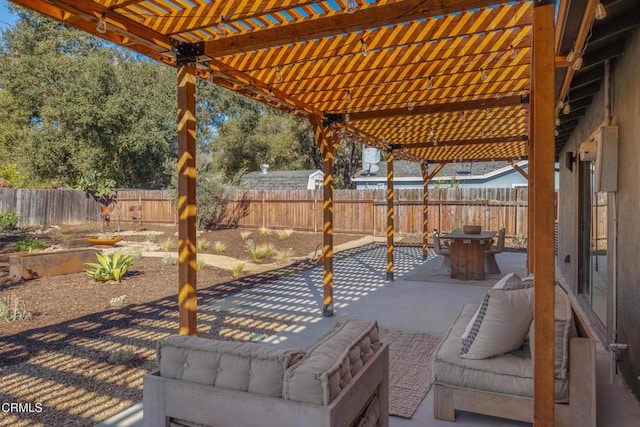 view of patio / terrace with outdoor dining area, a fenced backyard, and a pergola