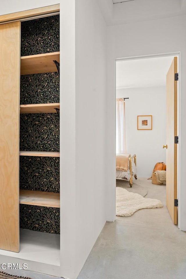 interior space featuring finished concrete floors