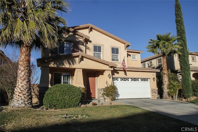 view of front of house featuring a garage and a front lawn