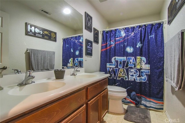 bathroom with vanity, tile patterned flooring, toilet, and a shower with shower curtain