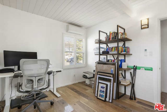 office space featuring beam ceiling, wood-type flooring, an AC wall unit, and wooden ceiling