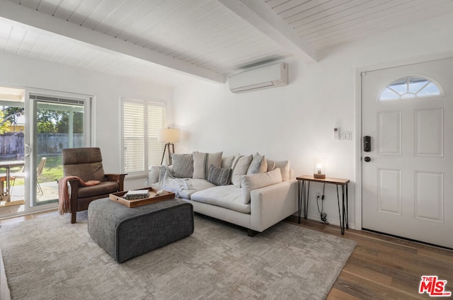 living room with wood-type flooring, beam ceiling, and a wall mounted AC