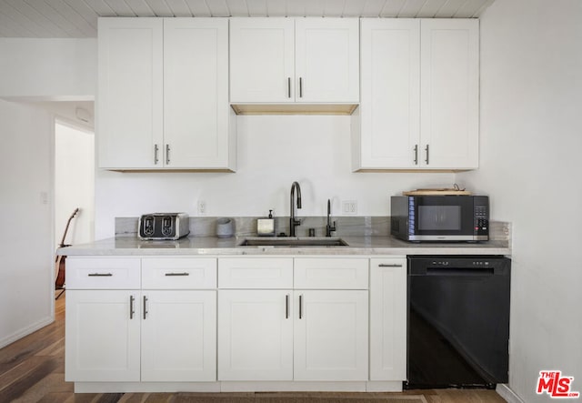 kitchen featuring dark wood-type flooring, black dishwasher, white cabinetry, and sink