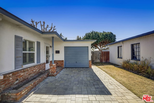 view of patio / terrace featuring a garage