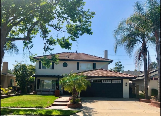 mediterranean / spanish house with a front lawn