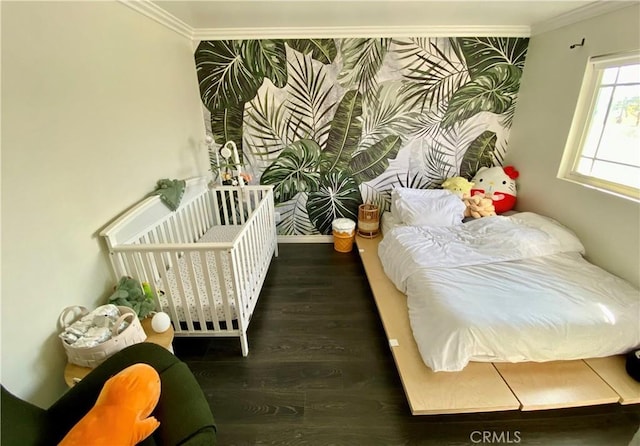 bedroom with crown molding and dark hardwood / wood-style flooring