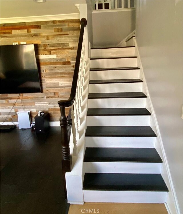 stairway with wooden walls