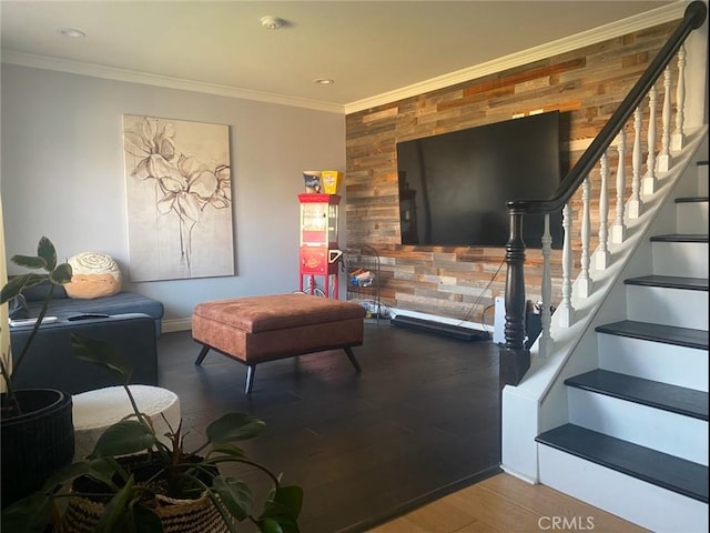 living room with crown molding and hardwood / wood-style floors