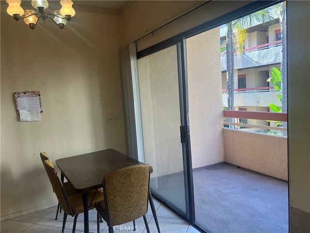 tiled dining area with a chandelier