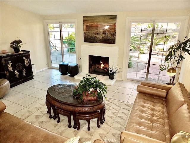 living room with tile patterned flooring and a fireplace