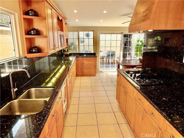 kitchen with a sink, open shelves, backsplash, gas stovetop, and light tile patterned flooring