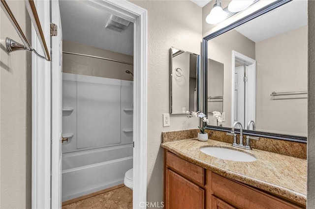 full bathroom with tile patterned floors, vanity, toilet, and shower / washtub combination