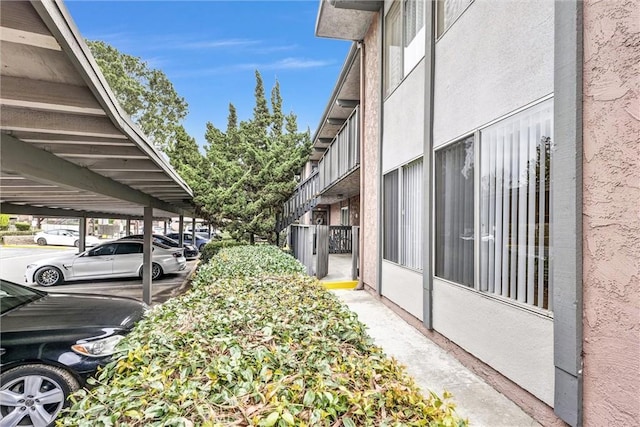 exterior space with a carport