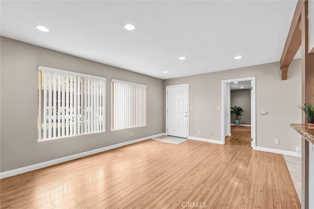 unfurnished living room with light hardwood / wood-style floors