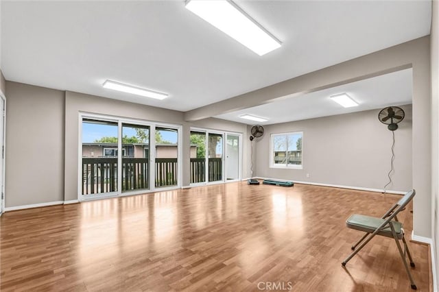 workout area with hardwood / wood-style floors