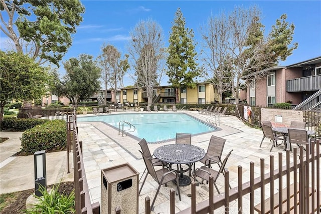 view of swimming pool featuring a patio area